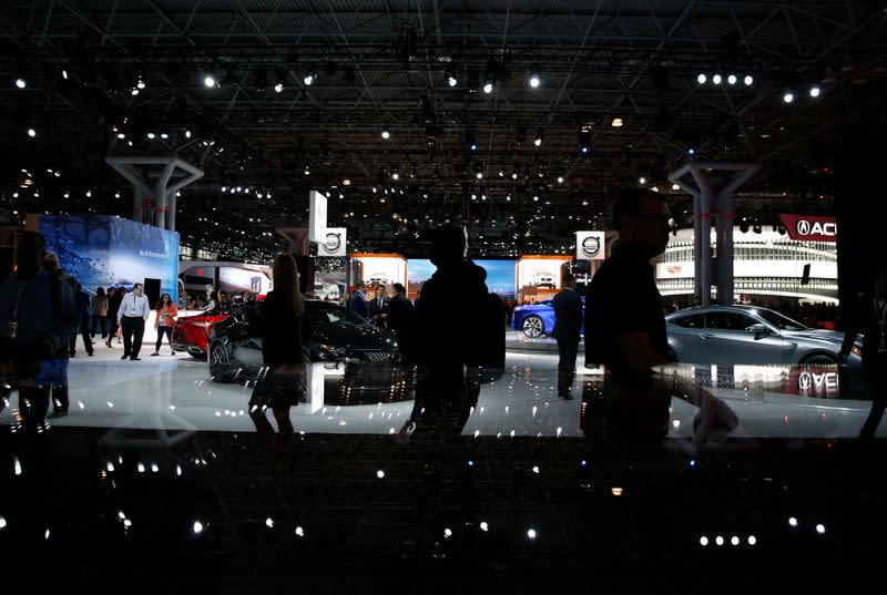 Members of the media attend the New York Auto Show in New York