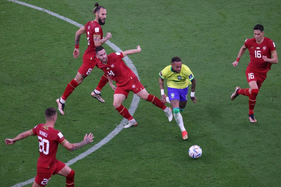 Neymar of Brazil cuts between Andrija Zivkovic (l) and Sasa Lukic (r) of Serbia during the FIFA World Cup Qatar 2022 Group G match between Brazil and Serbia at Lusail Stadium (Getty Images)