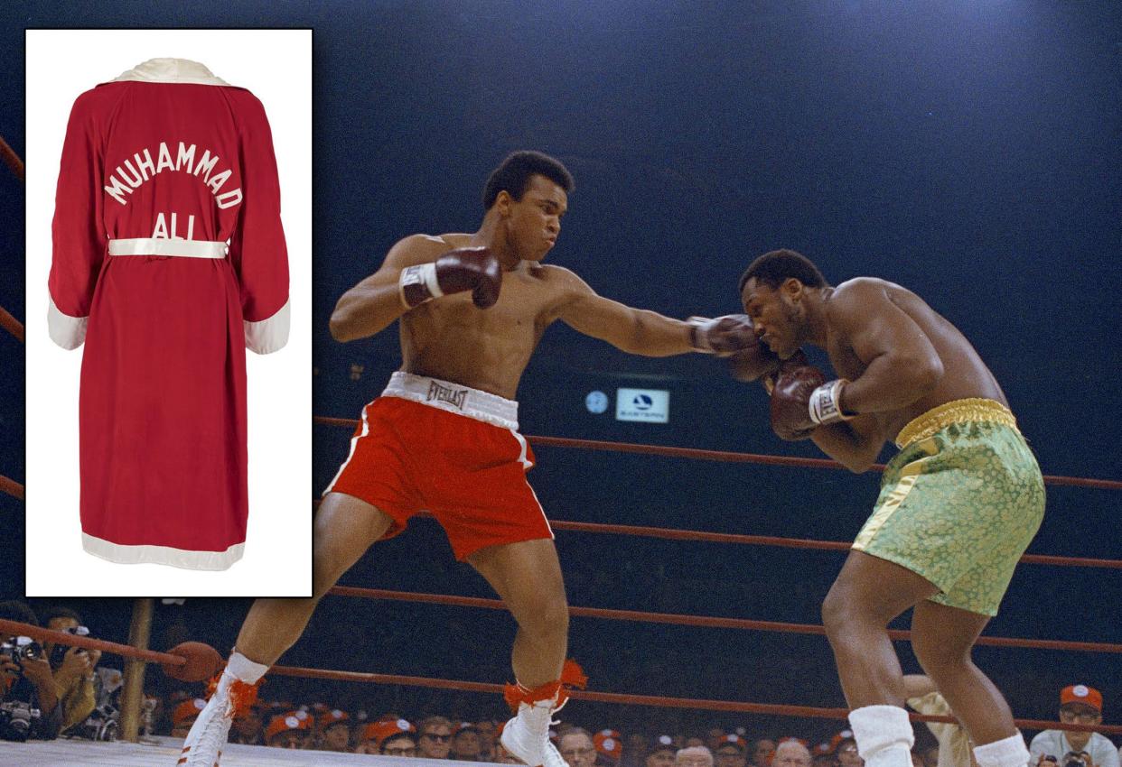 Muhammad Ali in red trunks, and Joe Frazier in green trunks, during round 5 or 6 of their bout at Madison Square Garden on March 8, 1971. 