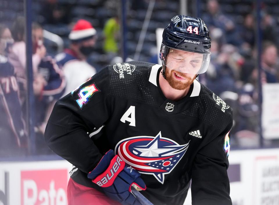 Columbus Blue Jackets defenseman Vladislav Gavrikov (44) gives fans a wink as he warms up prior to the NHL hockey game against the New Jersey Devils at Nationwide Arena in Columbus on March 1, 2022. 