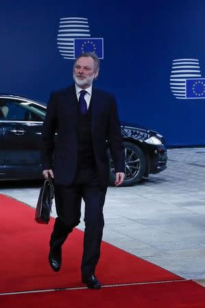 Britain's permanent representative to the European Union Tim Barrow arrives at the EU Council headquarters for as meeting before hand delivering British Prime Minister Theresa May's notice of the UK's intention to leave the bloc under Article 50 of the EU's Lisbon Treaty to EU Council President Donald Tusk in Brussels, Belgium March 29, 2017. REUTERS/Yves Herman