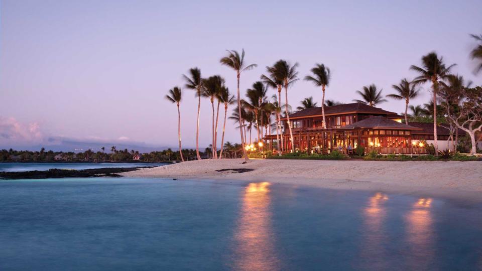 Dusk view of the Four Seasons Resort Hualalai, voted one of the best resorts and hotels in Hawaii