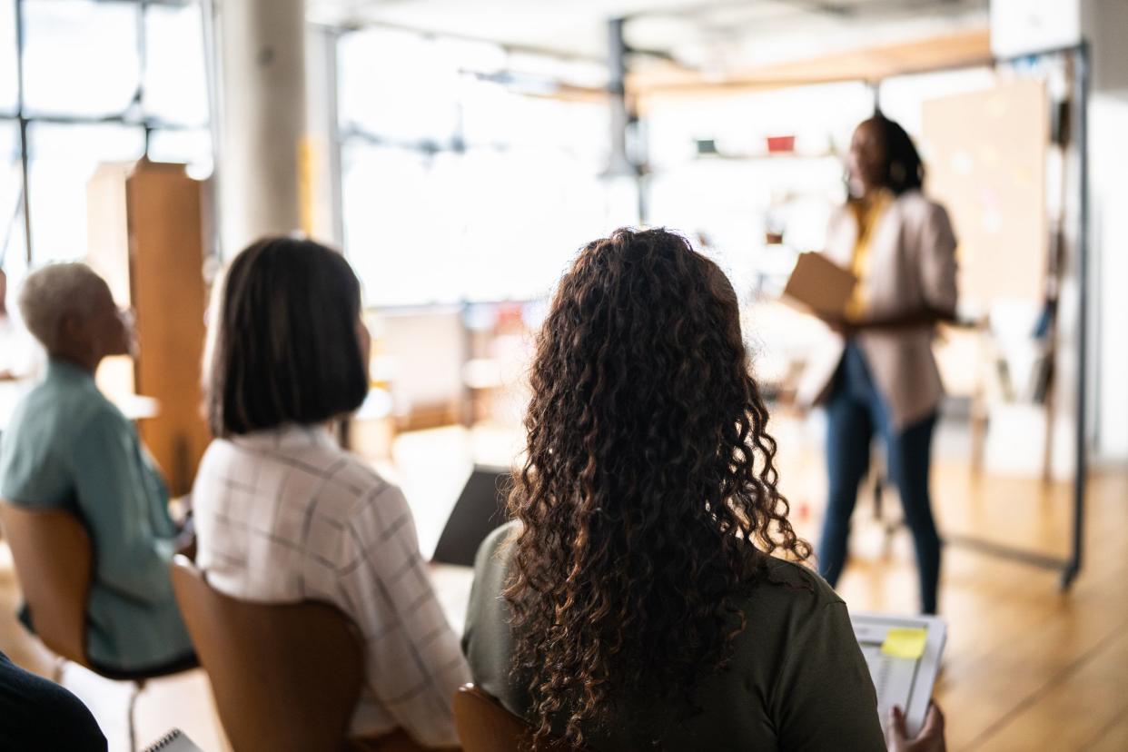 Businesswoman doing a presentation to the women's