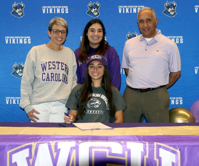Lakeland Christian senior Maddie Lopez poses with her family after signing with Western Carolina. Standing from left are her mother Kelly, her sister MacKenzie and her father Frank.
