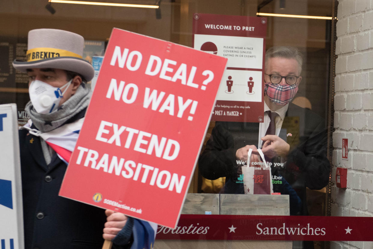 Chancellor of the Duchy of Lancaster, Michael Gove buys coffee from a cafe in Westminster, central London as ongoing talks to strike a post-Brexit trade deal take place this morning.