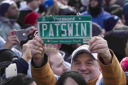 A fan holds a license plate reading "PATSWIN" during the New England Patriots Super Bowl XLIX victory parade in Boston, Massachusetts February 4, 2015. REUTERS/Katherine Taylor