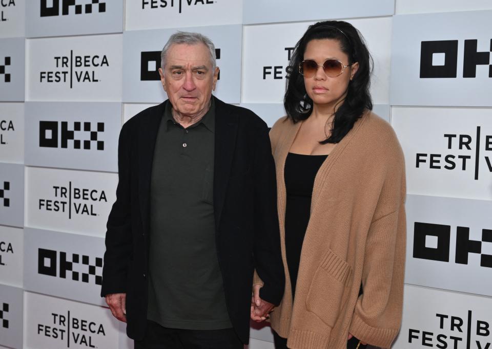 Robert De Niro and his girlfriend Tiffany Chen arrive to the screening of "Kiss the Future" during the opening night of the Tribeca Film Festival at OKX Theater in New York City on June 7, 2023.