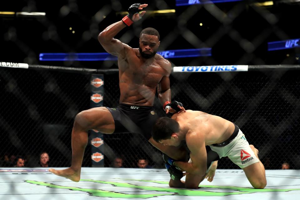Tyron Woodley (black shorts) fights Demian Maia of Brazil in the Welterweight title bout during UFC 214 at Honda Center on July 29, 2017 in Anaheim, California.