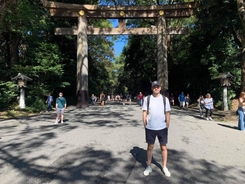 In this photo provided by Sebastian Bressa, Bressa visits Meiji shrine during his trip in Tokyo, Japan, on Oct. 2019. More than a year ago Bressa finished his paperwork to become a language teacher in Tokyo and made plans to quit his job in Sydney. His life has been in limbo ever since. Hundreds of thousands of foreigners have been denied entry to study, work or visit families in Japan, which has kept its doors closed to most overseas visitors during the pandemic.(Sebastian Bressa via AP)