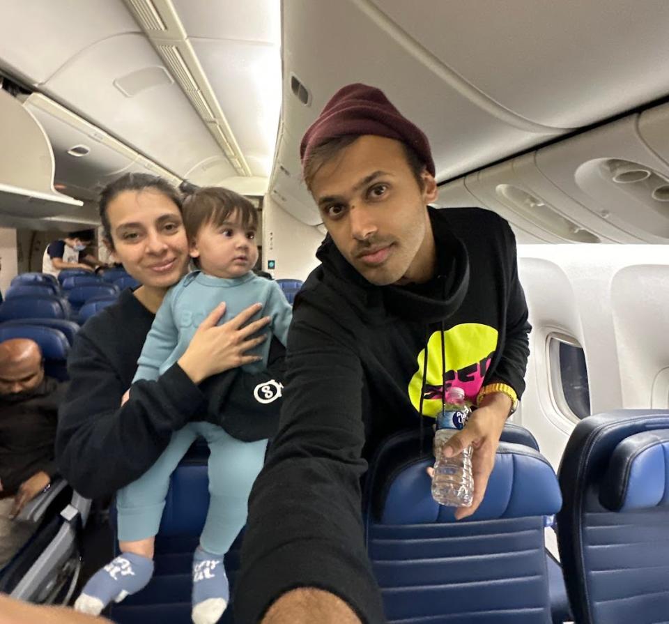 A family on a plane with a baby