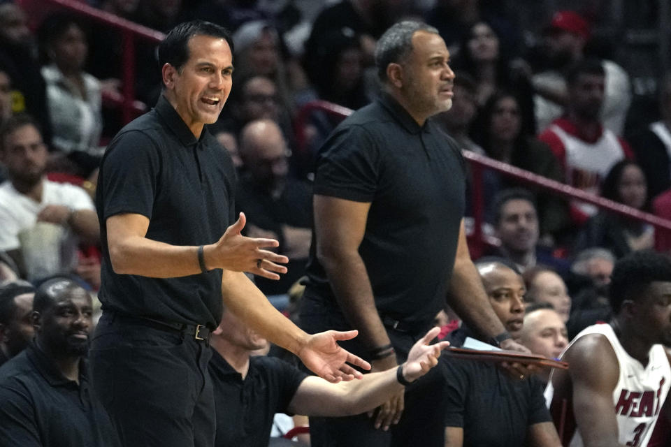 Miami Heat coach Erik Spoelstra, left, reacts during the second half of the team's NBA basketball game against the Chicago Bulls, Thursday, Dec. 14, 2023, in Miami. (AP Photo/Lynne Sladky)