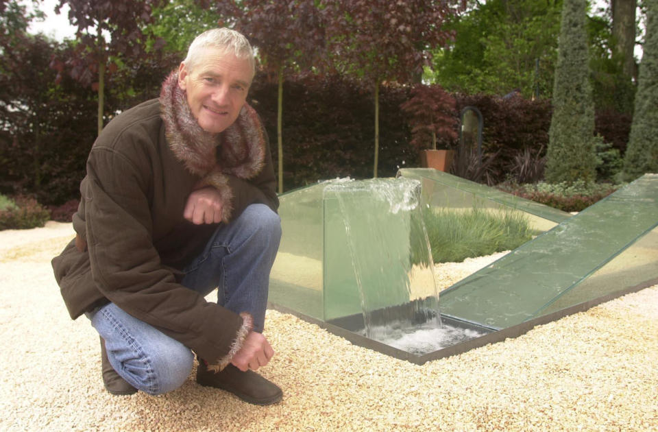 James Dyson crouches besides part of his 'The Wrong Garden' on display at the 2003 Chelsea Flower Show held in central London, that he designed with the help of Jim Honey. The garden's focal point is James's water fountain where water appears to flow upwards.  * The Chelsea Flower Show is held in the grounds of the Royal Hospital, Chelsea, and opens to Royal Horticultural Society (RHS) members on Tuesday and to the general public on Wednesday afternoon.