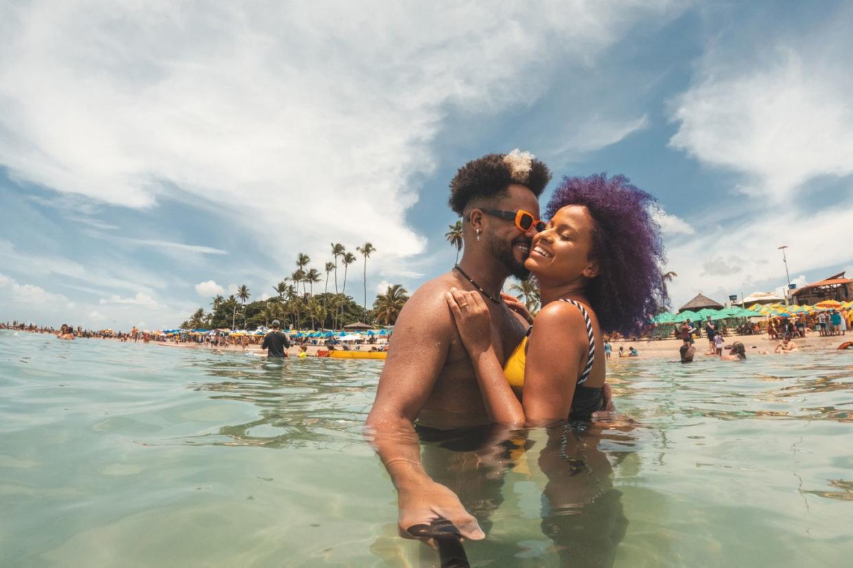 Black couple on vacation at the beach