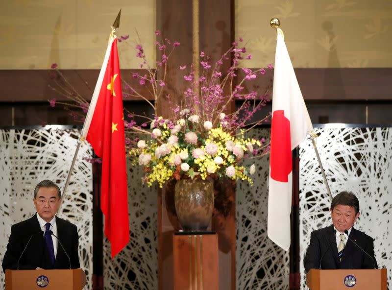 Chinese Foreign Minister Wang holds joint news announcement with Japanese counterpart Motegi