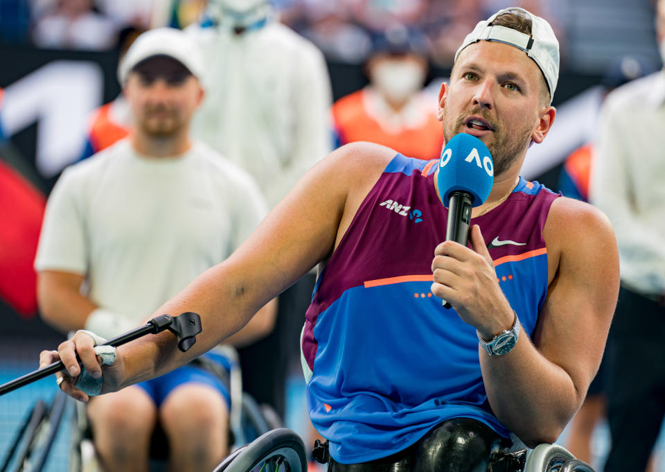 Dylan Alcott, pictured here speaking to the crowd after the quad wheelchair singles final at the Australian Open.