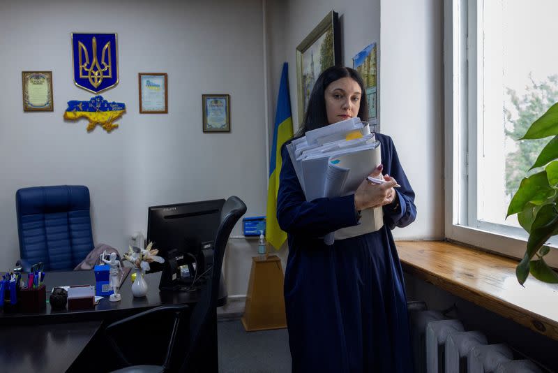 Vira Levko, a judge at the Dniprovskyi District Court of Kyiv City stands in her office in Kyiv