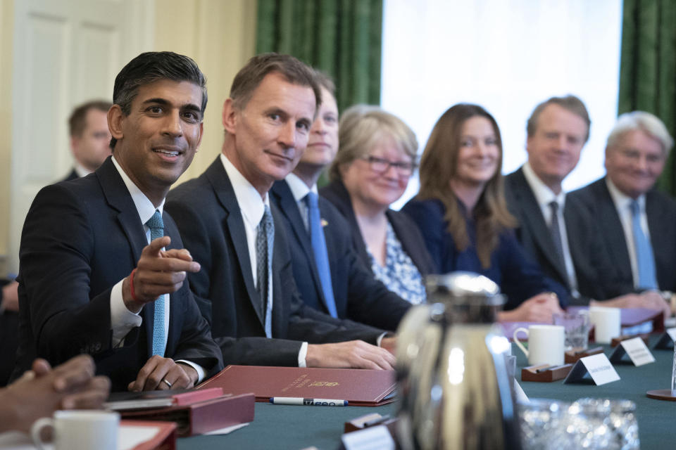 Autumn Budget Britain's Prime Minister Rishi Sunak, left, alongside the Chancellor of the Exchequer, Jeremy Hunt, second left, holds his first Cabinet meeting in Downing street in London, Wednesday, Oct. 26, 2022. (Stefan Rousseau/Pool Photo via AP)