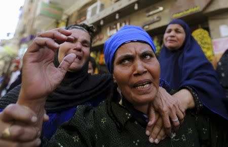 Relatives and families of members of the Muslim Brotherhood and supporters of ousted Egyptian President Mohamed Mursi react outside a court in Minya, south of Cairo, after the sentences of Muslim Brotherhood leader Mohamed Badie and his supporters were announced, June 21, 2014. REUTERS/Mohamed Abd El Ghany