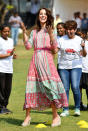 <p>Luckily, the Duchess planned ahead and wore wedges (£99 from Mint Velvet) that she was able to run around and play a spot of cricket in. <i>[Photo: Rex]</i></p>