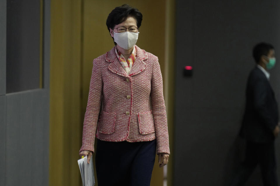 Hong Kong Chief Executive Carrie Lam arrives for a press conference in Hong Kong, Tuesday, Sept. 22, 2020. Lam said the semi-autonomous Chinese territory has seen its image damaged in the international arena following China’s imposition in June of a sweeping national security law demanding total loyalty to China’s ruling Communist Party. Lam declined to comment directly to reporters on the reasons behind the resignation of an Australian judge on Hong Kong’s top court that has raised the questions about the future of judicial independence in the territory. (AP Photo/Vincent Yu)