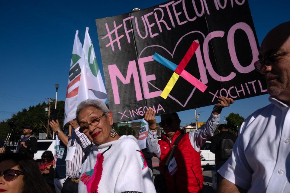 Supporters of Mexican presidential pre-candidate for the Frente Amplio por Mexico (Broad Front for Mexico), Xochitl Galvez, participate in a rally outside El Chaparral border crossing near the US (AFP via Getty Images)