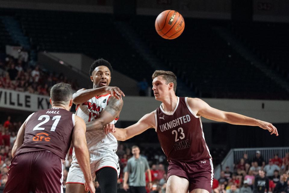 The Ville's David Johnson passes the ball between UKnighted defenders Saturday at Freedom Hall. Johnson had 17 points and eight rebounds in The Ville's first-round victory of The Basketball Tournament.