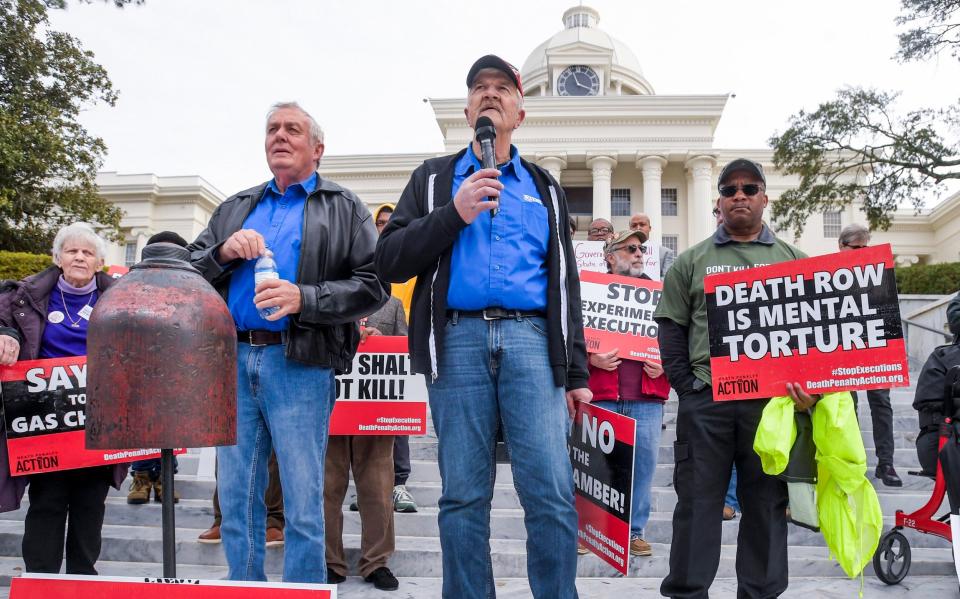 Exonerated former death row inmates protesting outside Alabama's state capitol building on Tuesday