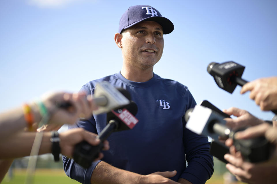 FILE - Tampa Bay Rays manager Kevin Cash talks with reporters during the first practice for pitchers and catchers at spring training baseball camp, Wednesday, Feb. 15, 2023, in Kissimmee, Fla. The Tampa Bay Rays have extended the contracts of manager Kevin Cash and president of baseball operations Erik Neander. The team announced the moves Thursday, Feb. 8, 2024. (AP Photo/Phelan M. Ebenhack)