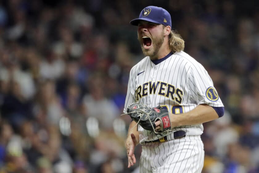 Milwaukee Brewers' Corbin Burnes reacts after striking out a batter during the seventh inning of a baseball game against the New York Mets on Sept. 25, 2021, in Milwaukee. Burnes won the NL Cy Young Award on Wednesday, Nov. 17, 2021. (AP Photo/Aaron Gash, File)