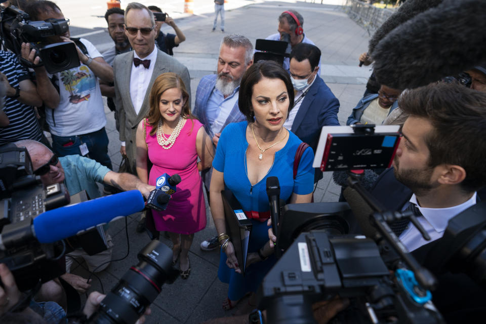 Sarah Ransome, an alleged victim of Jeffrey Epstein and Ghislaine Maxwell, right, alongside Elizabeth Stein, left, speak to members of the media outside federal court, Tuesday, June 28, 2022, in New York. Ghislaine Maxwell, the jet-setting socialite who once consorted with royals, presidents and billionaires, was set to be sentenced Tuesday for helping the wealthy financier Jeffrey Epstein sexually abuse underage girls. (AP Photo/John Minchillo)