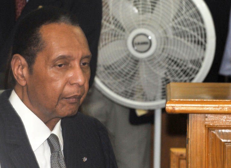Former Haitian president Jean-Claude "Baby Doc" Duvalier arrives in court in Port-au-Prince on Febuary 28, 2013. Former Haitian dictator Jean-Claude "Baby Doc" Duvalier appeared in court Thursday for a hearing to determine if he can be charged with crimes against humanity