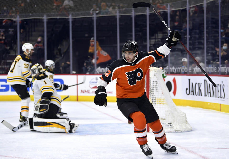 Philadelphia Flyers' Shayne Gostisbehere celebrates after scoring a goal past Boston Bruins goaltender Jeremy Swayman (1) during the first period of an NHL hockey game, Saturday, April 10, 2021, in Philadelphia. (AP Photo/Derik Hamilton)