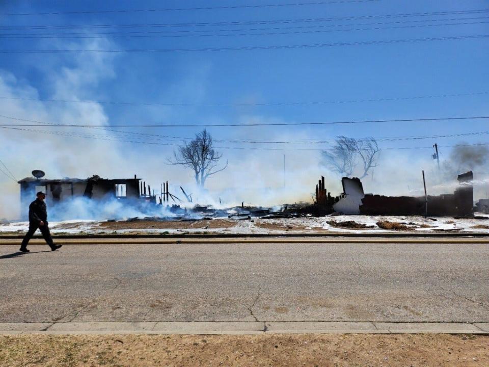 Amarillo firefighters battle a fire involving two structures near NW 3rd and N Jefferson near downtown Amarillo on Friday afternoon.