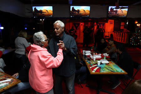 People dance as Jibaro music band plays at El Jibarito Restaurant where Puerto Ricans gather, in Kissimmee, Florida, U.S., December 10, 2017. REUTERS/Alvin Baez