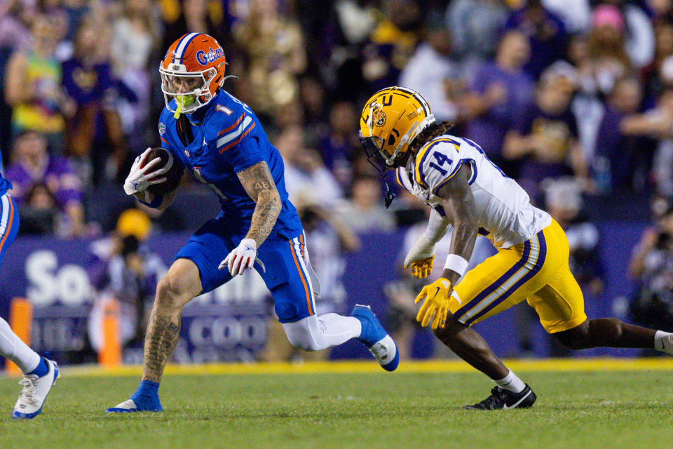 Nov 11, 2023; Baton Rouge, Louisiana, USA; Florida Gators wide receiver Ricky Pearsall (1) catches a pass against LSU Tigers safety Andre’ Sam (14) during the first half at Tiger Stadium. Mandatory Credit: Stephen Lew-USA TODAY Sports