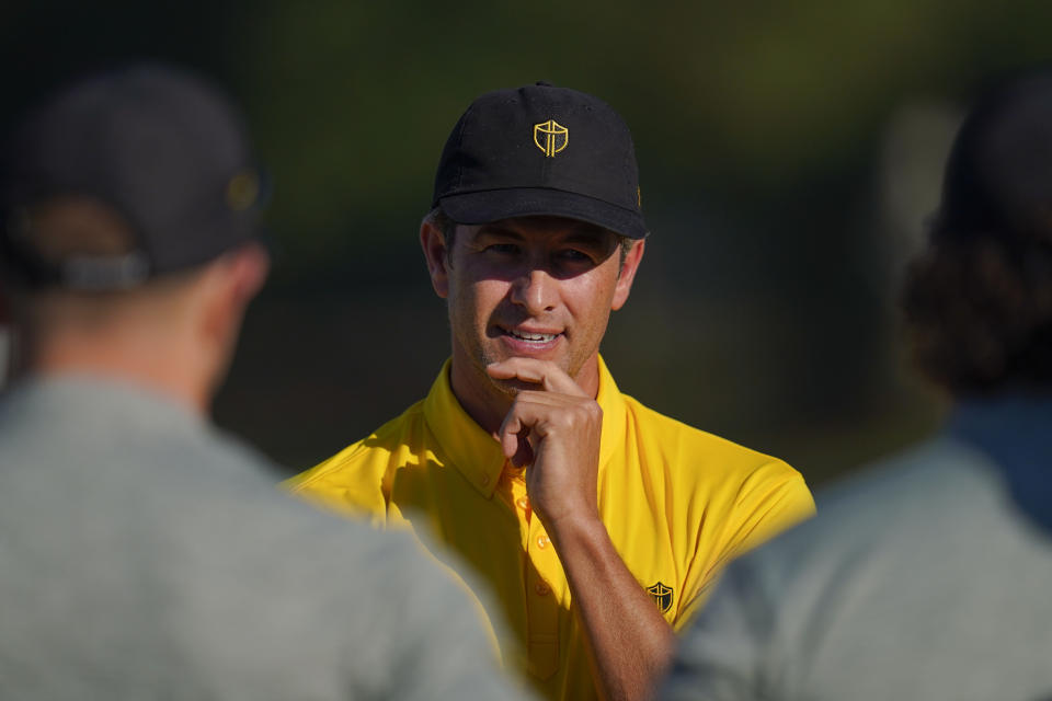 Adam Scott, of Australia, speaks during practice for the Presidents Cup golf tournament at the Quail Hollow Club, Wednesday, Sept. 21, 2022, in Charlotte, N.C. (AP Photo/Julio Cortez)