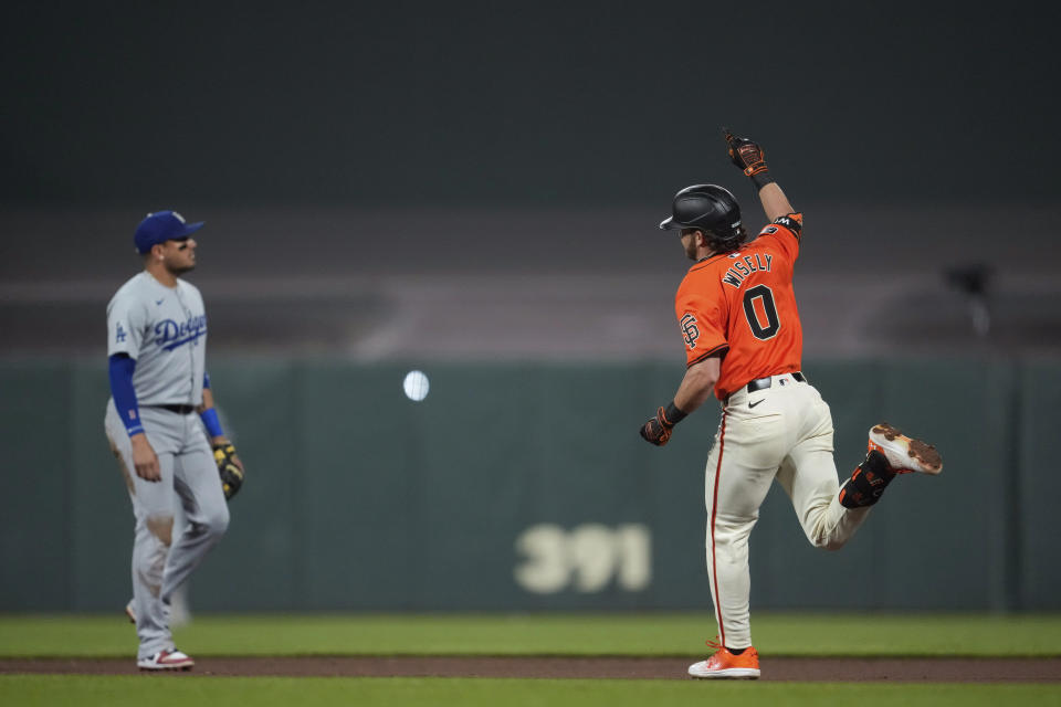 San Francisco Giants' Brett Wisely, right, celebrates after hitting a game-winning, two-run home run against the Los Angeles Dodgers during the ninth inning of a baseball game Friday, June 28, 2024, in San Francisco. (AP Photo/Godofredo A. Vásquez)