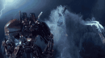 A battle from "Pacific Rim" taking place at night and in the water