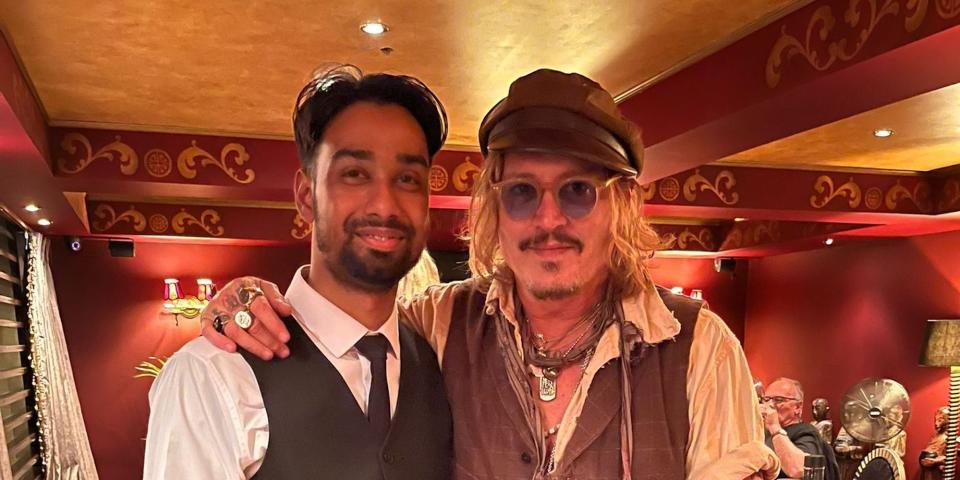 Johnny Depp with staff of Varanasi Indian restaurant in Birmingham, England on June 5, 2022