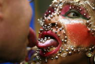 LONDON - NOVEMBER 11: Worlds most pierced woman Elaine Davidson and man with longest tongue Stephan Taylor pose for photographers at the photocall for the 100 millionth copy of the Guinness World Records in the Tate Modern on November 11, 2003, in London. (Photo by Bruno Vincent/Getty Images)