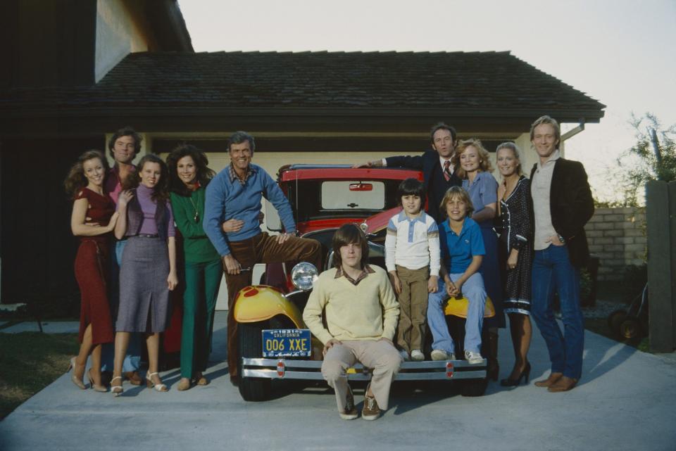 The cast of Knots Landing, Jacobs's passion project, which launched in 1979 and ran until 1993. From left to right: Kim Landford (as Ginger Ward), James Houghton (as Kenny Ward), Claudia Lonow (as Diana Fairgate), Michele Lee (as Karen Fairgate), Don Murray (as Sid Fairgate), Steve Shaw (as Eric Fairgate), Justin Dana (as Jason Avery), (unknown actor), John Pleshette (as Richard Avery), Constance McCashin (as Laura Avery), Joan Van Ark (as Valene Ewing), Ted Shackelford (as Gary Ewing)