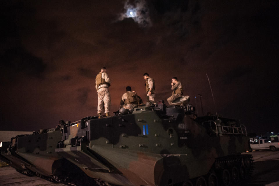 Charlie Company of the 4th Assault Amphibious Battalion, Marine Forces Reserve arrive at the Central Mall in Port Arthur, TX on Thursday night after running rescue missions in the hardest hit areas of town throughout the day.