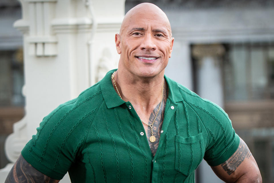 Dwayne Johnson posing and smiling for a photo