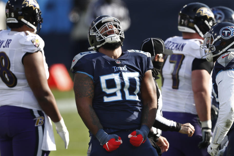 Tennessee Titans defensive end DaQuan Jones (90) celebrates after a play against the Baltimore Ravens in the first half of an NFL wild-card playoff football game Sunday, Jan. 10, 2021, in Nashville, Tenn. (AP Photo/Wade Payne)