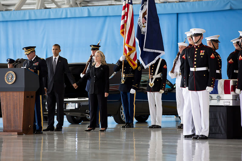 <b>Sept. 14, 2012:</b> "The President grasps the hand of the Secretary of State after his remarks during the ceremony at Joint Base Andrews, marking the return to the United States of the remains of J. Christopher Stevens, U.S. Ambassador to Libya; Sean Smith, Information Management Officer; and Security Personnel Glen Doherty and Tyrone Woods, who were killed in the attack on the U.S. Consulate in Benghazi, Libya." (Official White House Photo by Pete Souza)