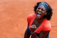 FILE PHOTO: Serena Williams reacts after dismantling Aleksandra Wozniak 6-1 6-2 in their French Open fourth round clash to extend her winning streak in Grand Slams to 18 matches.