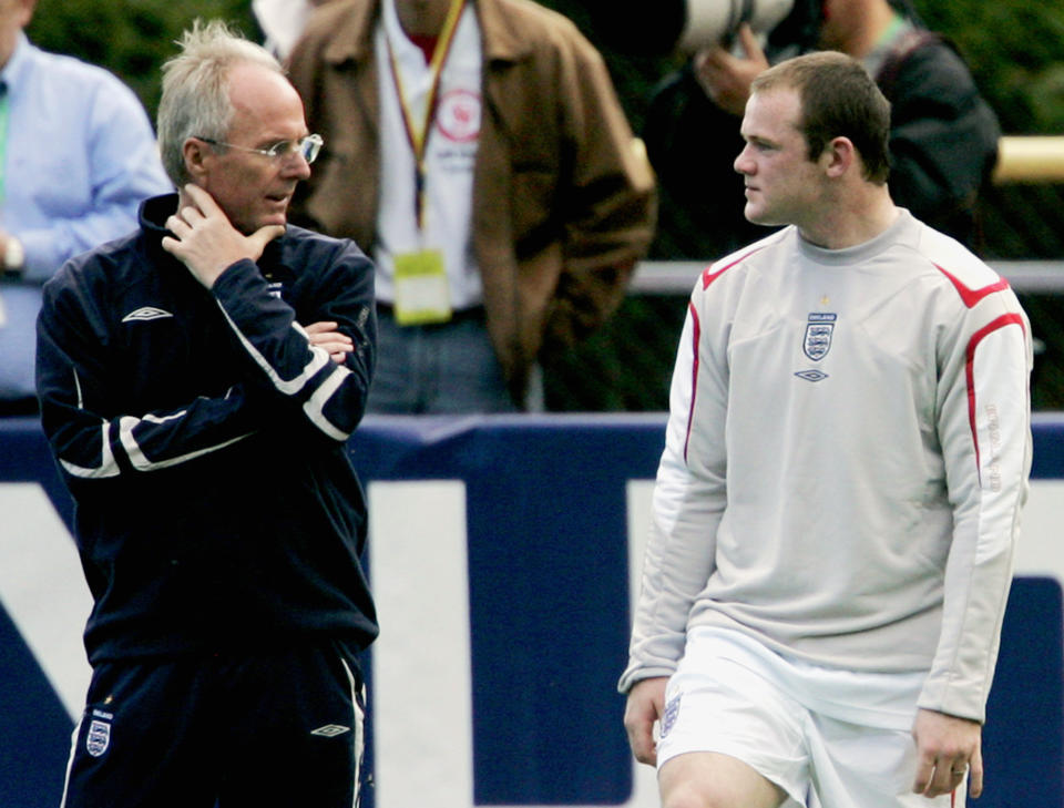 FILE - England striker Wayne Rooney, right, chats with his then manager Sven Goran-Eriksson, left, during an England national soccer squad training session for the World Cup at Mittelbergstadion in Buehlertal, Germany, Tuesday June 6, 2006. Swedish soccer coach Sven-Goran Eriksson says he has cancer and might have less than a year to live. The former England coach has told Swedish Radio he discovered he had cancer after collapsing suddenly. (AP Photo/Matt Dunham, File)