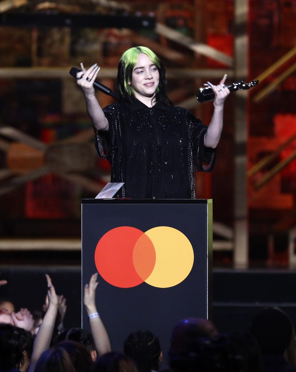 Billie Eilish accepts her award for International Female Solo Artist on stage at the Brit Awards 2020 in London, Tuesday, Feb. 18, 2020. (Photo by Joel C Ryan/Invision/AP)