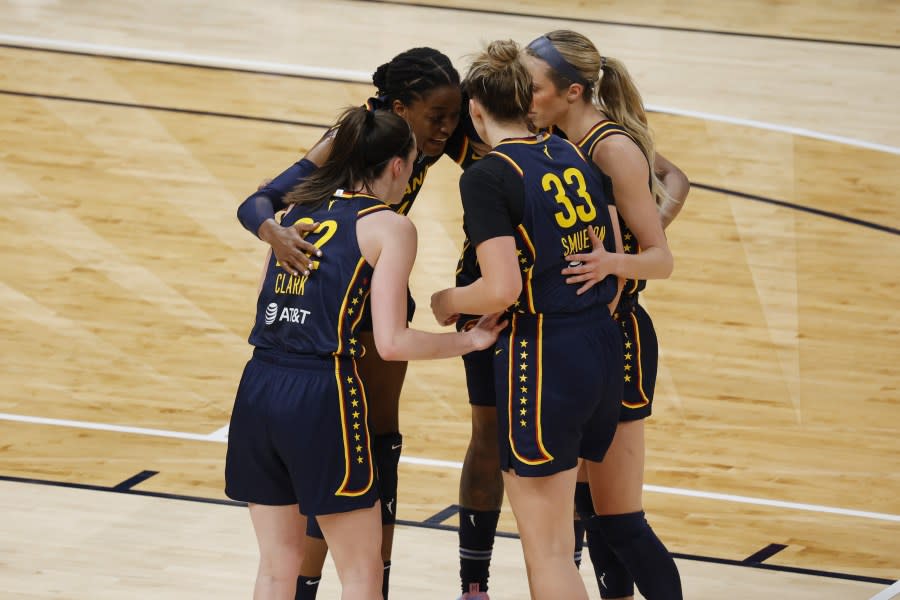 INDIANAPOLIS, IN – MAY 09: Indiana Fever guard Caitlin Clark (22) huddles up with her team while playing against the Atlanta Dream during a WNBA preseason game on May 9, 2024, at Gainbridge Fieldhouse in Indianapolis, Indiana. (Photo by Brian Spurlock/Icon Sportswire via Getty Images)
