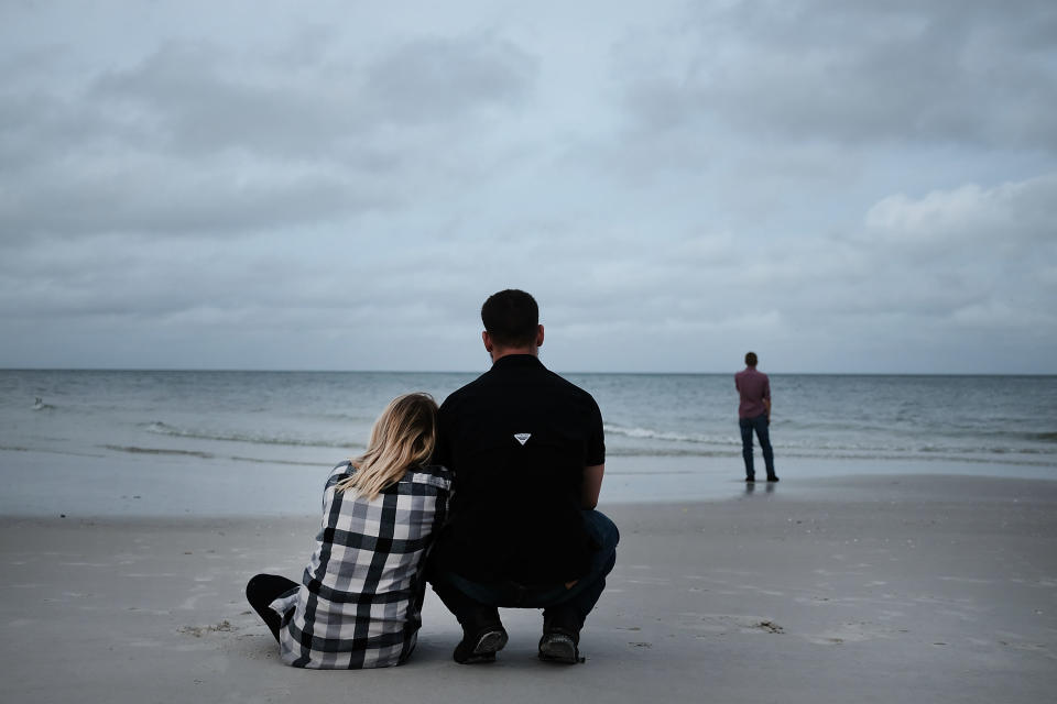 NAPLES, FL - SEPTEMBER 09:  People gather around the beach in Naples before the arrival of Hurricane Irma into Southwest Florida on September 9, 2017 in Naples, Florida. The Naples area could begin to feel hurricane-force winds from Irma by 11 a.m. Sunday and experience  wind gusts over 100 mph from Sunday through Monday.  (Photo by Spencer Platt/Getty Images)